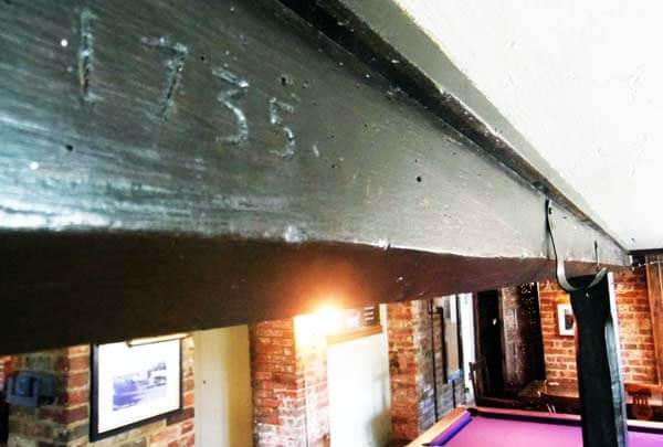 Photo image of the gibbet beam in the Hare & Hounds pub on which Michal Morey was suspended in chains.