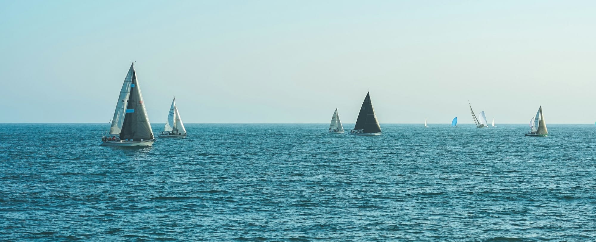 sailboats on body of water during daytime