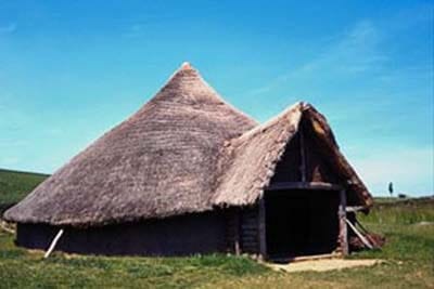 Photo image of reconstructed pit-based dwelling hut from Celtic times.